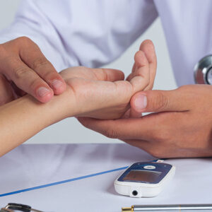 doctor is checking patience sugar level to monitor diabetes