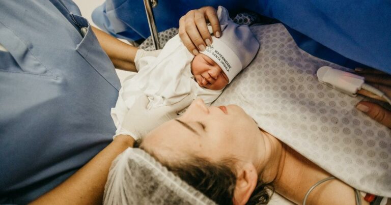Nurse midwife and newborn baby